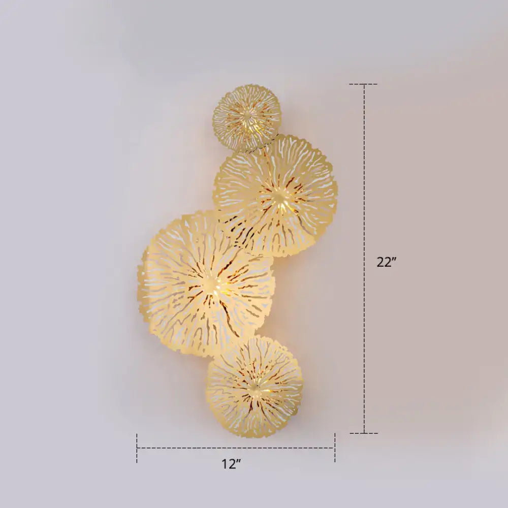 Artistic golden lotus leaf sconce light fixture with gold-toned coral-inspired layered wall art design for living room