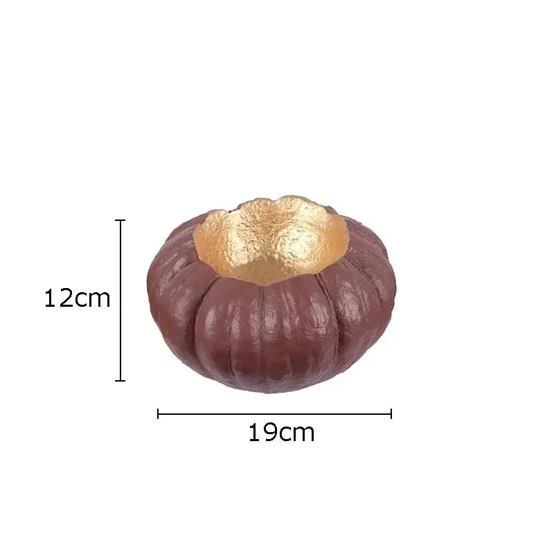 Artistic green and white gold pumpkin resin sculpture featuring a brown textured chestnut-shaped bowl with gold foil interior decorbites gold pumpkin
