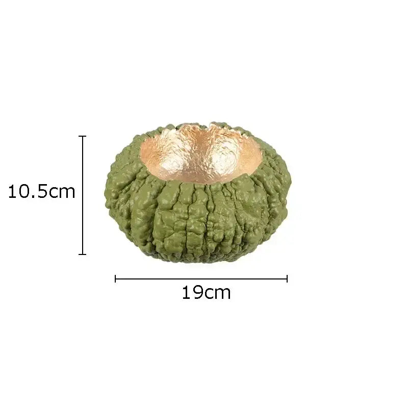 Artistic olive-green decorbites gold pumpkin resin candle holder with textured exterior and reflective gold interior for living room decor
