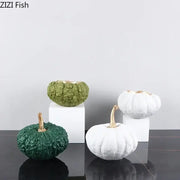 Set of four decorative pumpkin resin sculptures in green white and textured finishes with gold stems for decorbites gold pumpkin decor