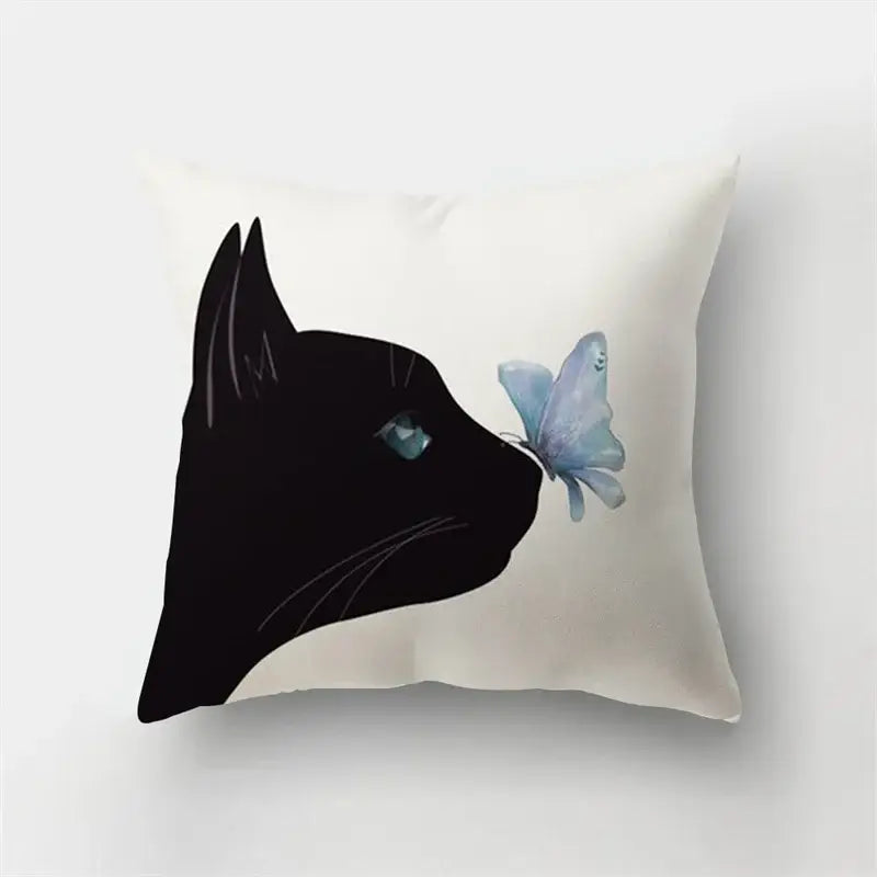 Cream-colored short plush pillowcase with black cat silhouette and teal eyes interacting with a light blue butterfly decorbites deer animal