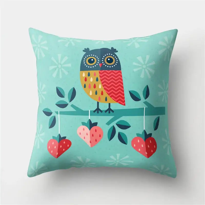 Teal pillow cover featuring a stylized cute owl with colorful feathers perched above heart-shaped strawberries decorbites cute owl