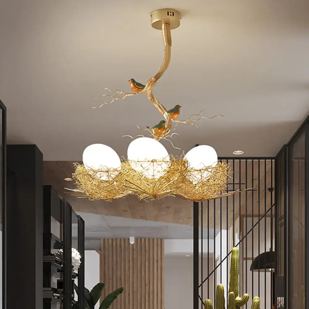 Golden decorbites™ chandelier pendant with milk white glass ball shades in hand-sewn aluminum bird nest design