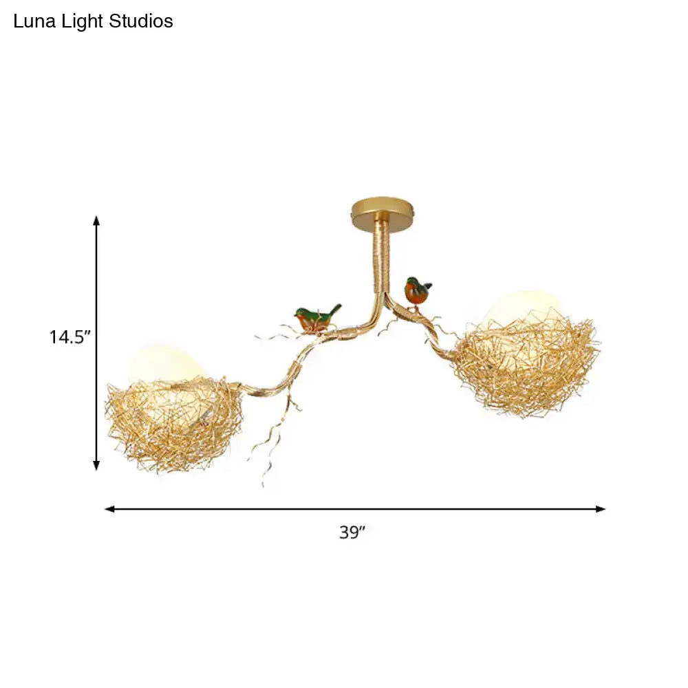 Gold-toned DecorBites™ chandelier with milk white glass ball shades and bird figurines on hand-sewn aluminum nests