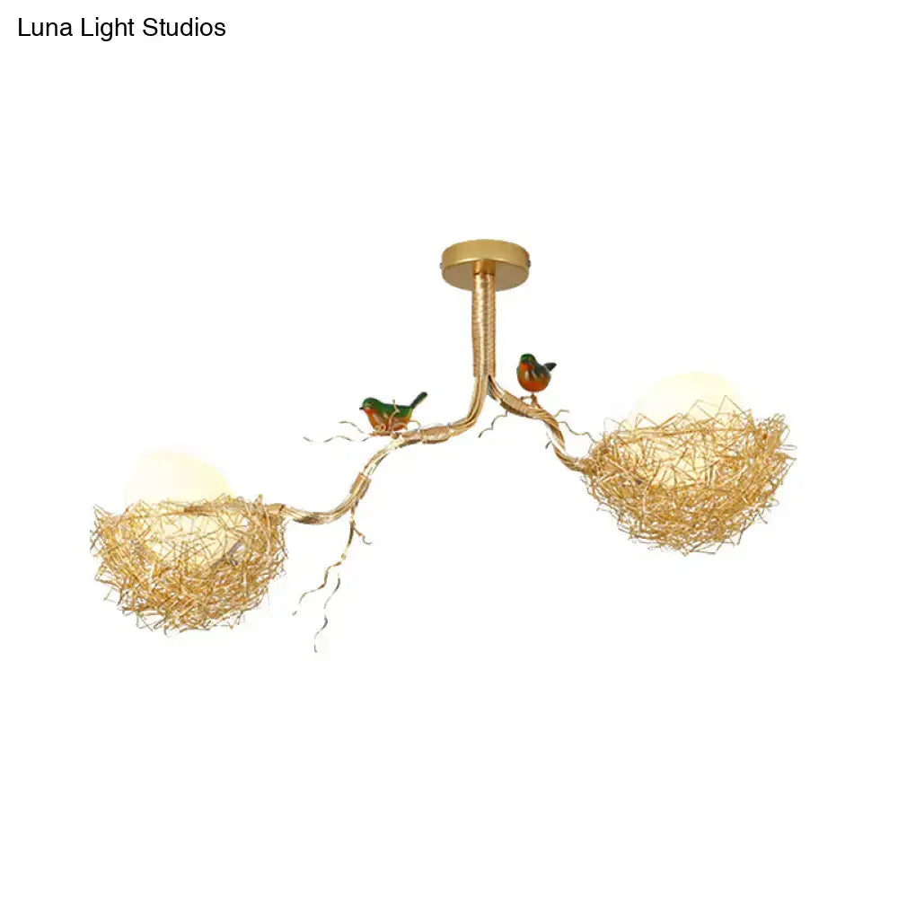 Gold-toned DecorBites™ chandelier pendant with milk white glass ball shades and hand-sewn aluminum bird nests