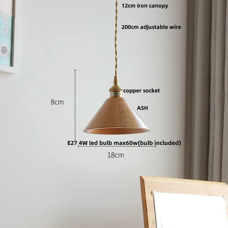 A warm-toned copper conical pendant lamp with brass-finished iron canopy and adjustable wire for decorbites ash wood settings
