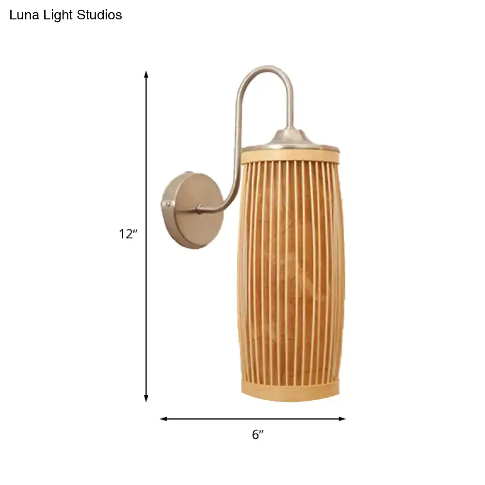 A 12-inch tall brushed nickel wall lamp with a gooseneck arm and cylindrical bamboo shade featuring vertical slats