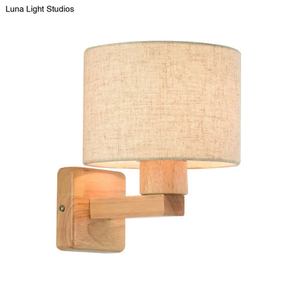 Lámpara de pared de tambor de inspiración asiática con brazo de madera y pantalla de tela, 1 luz, para dormitorio