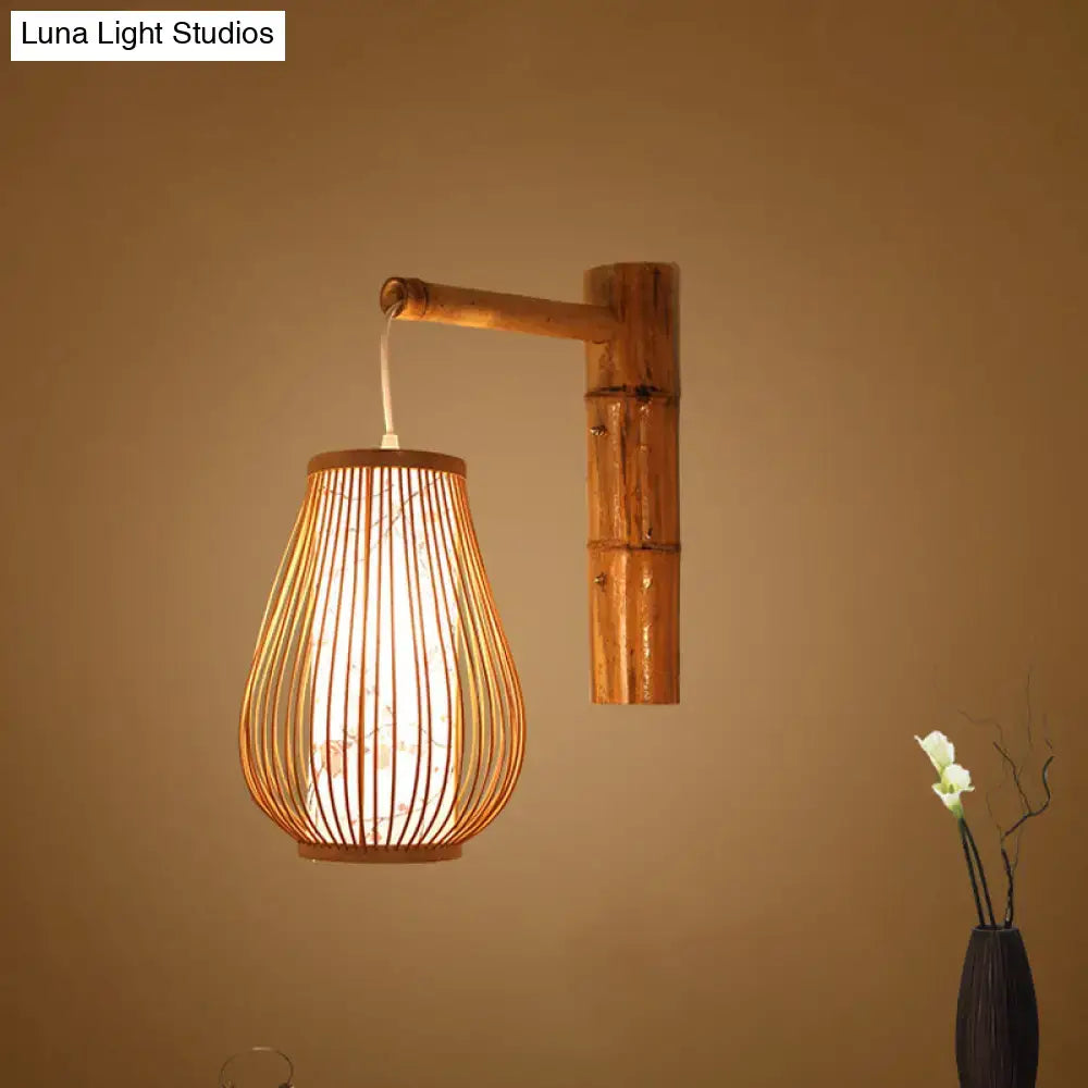 Asian pink cherry blossom bamboo teardrop sconce wall lamp with natural bamboo and woven rattan shade for bedroom use