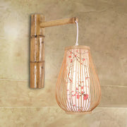Asian pink cherry blossom bamboo teardrop sconce wall lamp made of natural woven bamboo for bedroom use