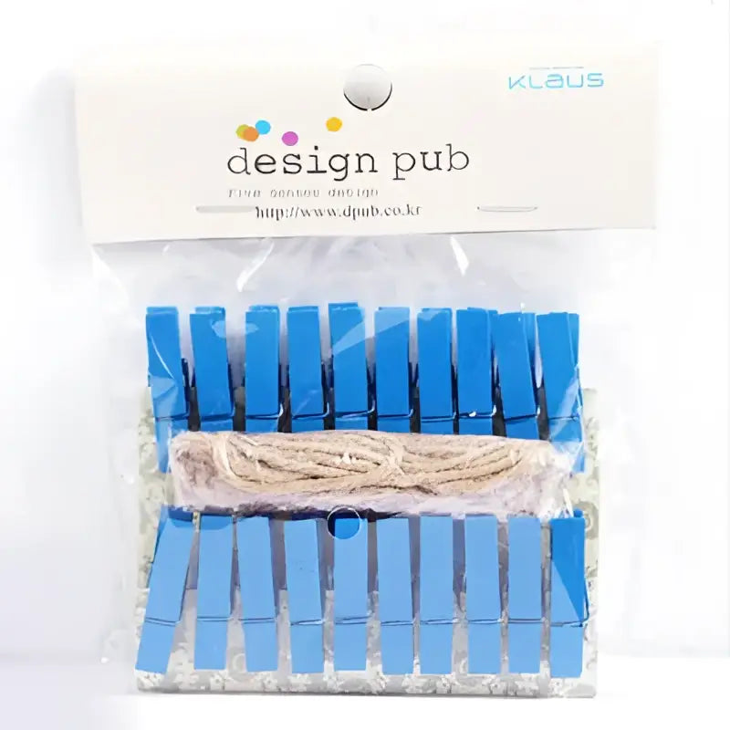 Blue mini wooden clips with a spool of beige twine inside package for bedroom photo decor and crafting use