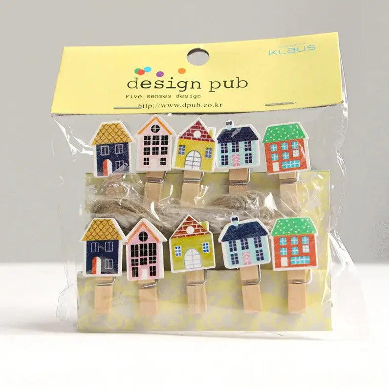 Assorted colorful mini wooden clips shaped like houses with painted roofs and windows in clear plastic bag for decor
