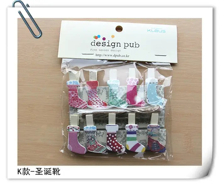 A set of assorted colorful heart mini wooden clips in christmas stocking shapes with design pub packaging for photo decor