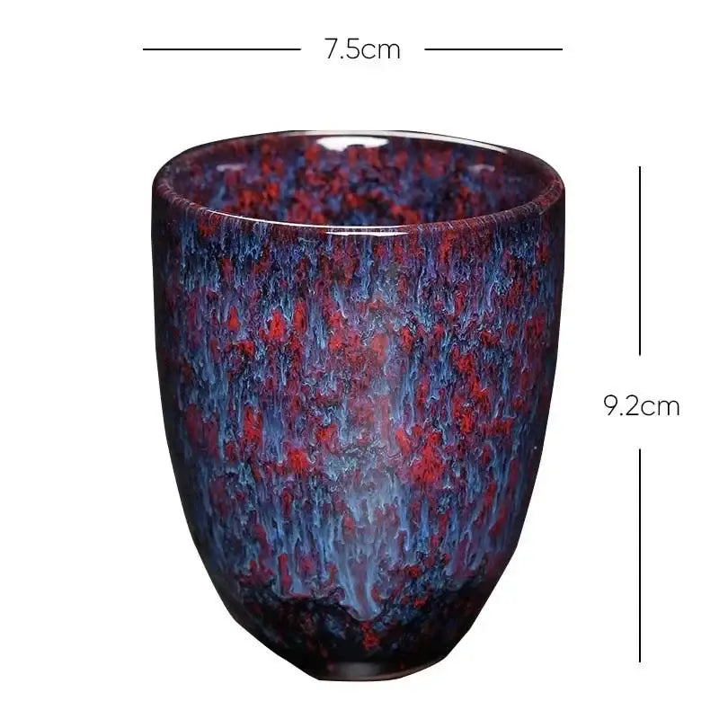 A glossy ceramic kung fu tea cup with vibrant blue and fiery red crackle glaze from decorbites ceramic kung set