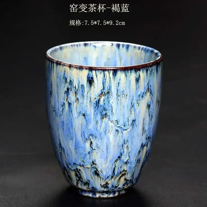 A ceramic tea cup with swirling blue and white crackle glaze and brown rim accents from decorbites ceramic kung fu tea set