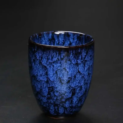 A deep blue ceramic kung fu tea cup with a textured crackle glaze finish from decorbites ceramic kung set