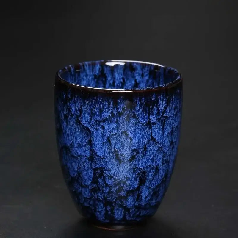 A deep blue ceramic kung fu tea cup with a textured crackle glaze finish from decorbites ceramic kung set