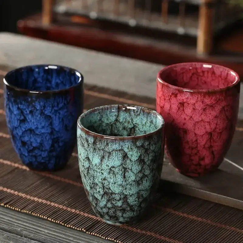 Three handcrafted decorbites ceramic kung fu tea cups with crackled glazes in blue teal and red for tea use
