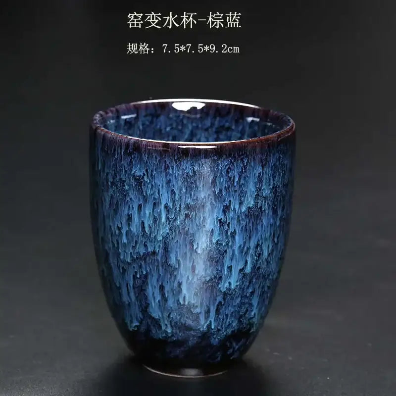 A ceramic kung fu tea cup with deep blue crackle glaze and purple undertones from decorbites ceramic kung set
