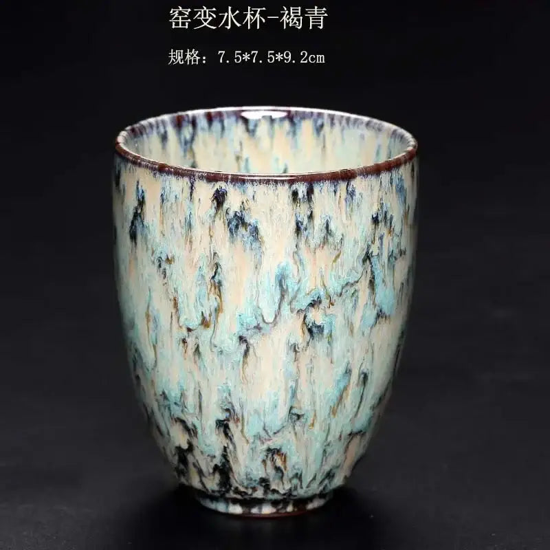 A ceramic kung fu tea cup with mottled teal cream and dark brown crackle glaze from decorbites tea cups set