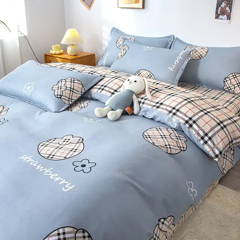 Light blue bedding set with playful plaid strawberries and white flowers featuring cursive strawberry script decorbites cartoon lattice floral design