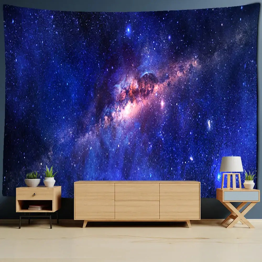 Vibrant decorbites astronaut moon tapestry wall hanging featuring deep blues purple and pink nebulae for living room decor