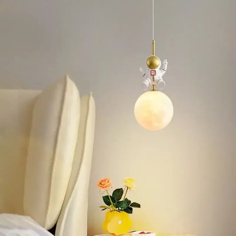Astronaut moon white and gold led pendant light with a whimsical frosted spherical globe for bedroom decor