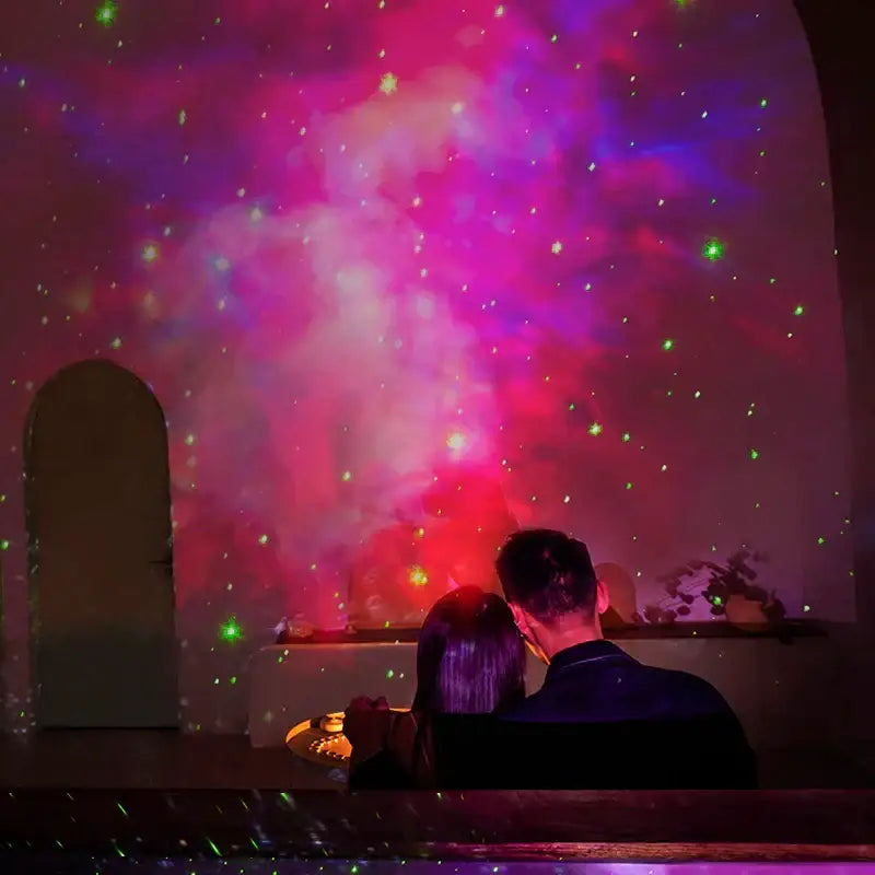 Astronaut sky projector nightlight in white and gold projecting vibrant pink and purple galaxy with green stars decorbites astronaut sky