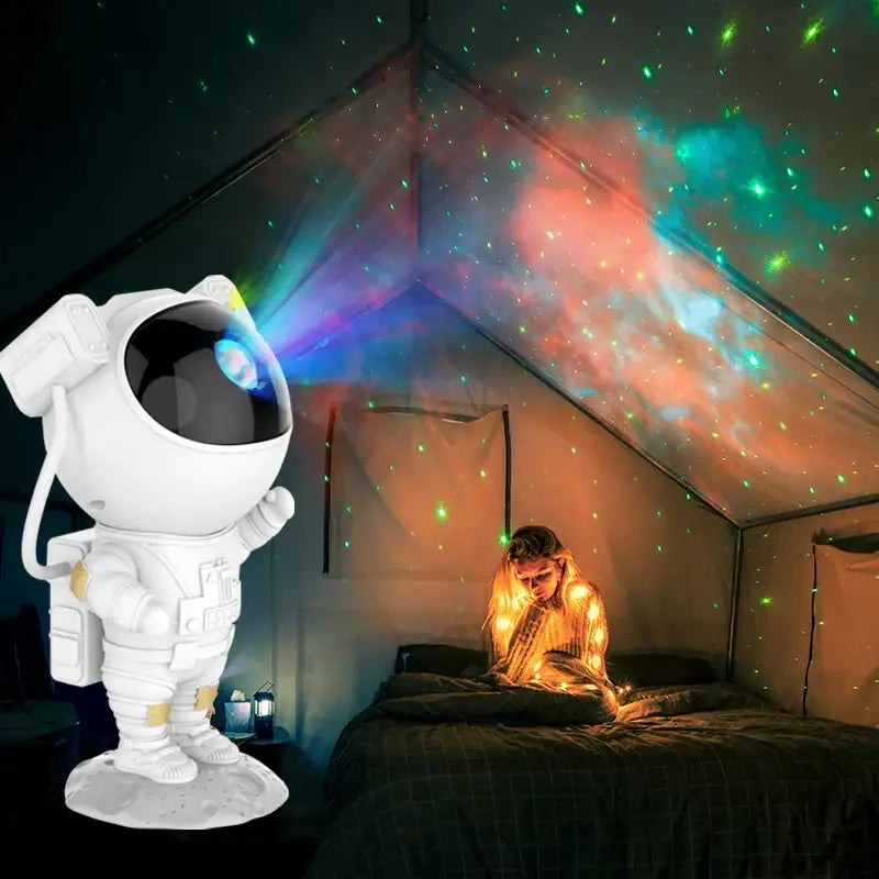 White and gold decorbites astronaut sky projector nightlight casting colorful starry galaxy patterns on ceiling