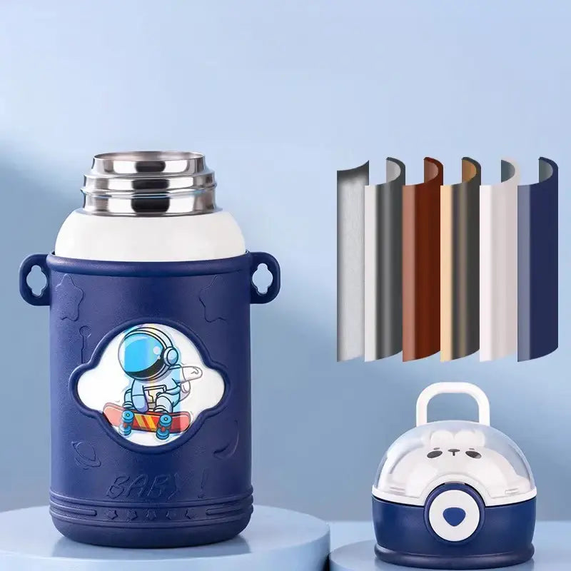 Blue astronaut-themed stainless steel thermos bottle with white lid and cartoon straw silicone sleeve for kids room