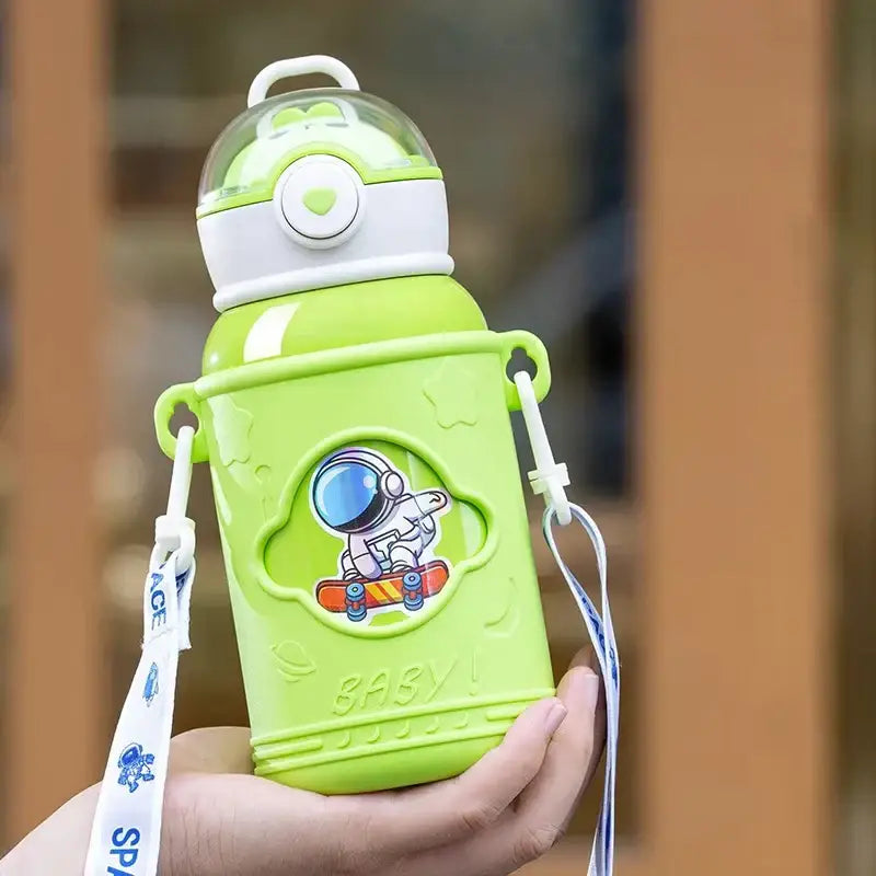 Bright lime green stainless steel thermos bottle for kids with white lid cartoon straw and astronaut sticker strap
