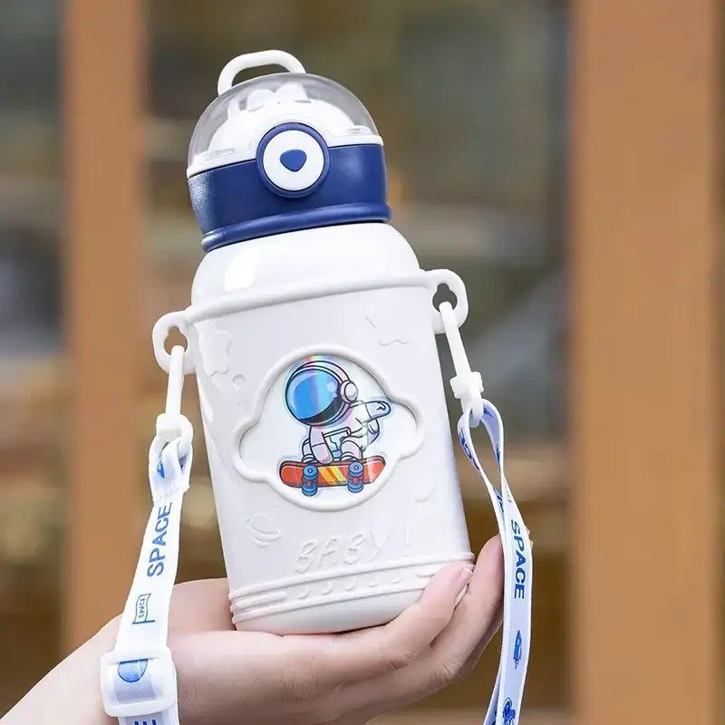White stainless steel thermos bottle with blue accents featuring cartoon astronaut on skateboard and detachable space strap