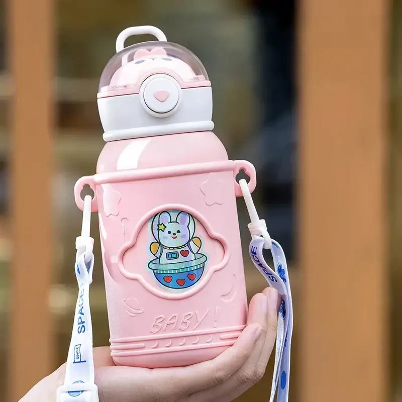 Pink plastic thermos bottle with white lid featuring bunny face and cartoon straw for kids with stainless steel design