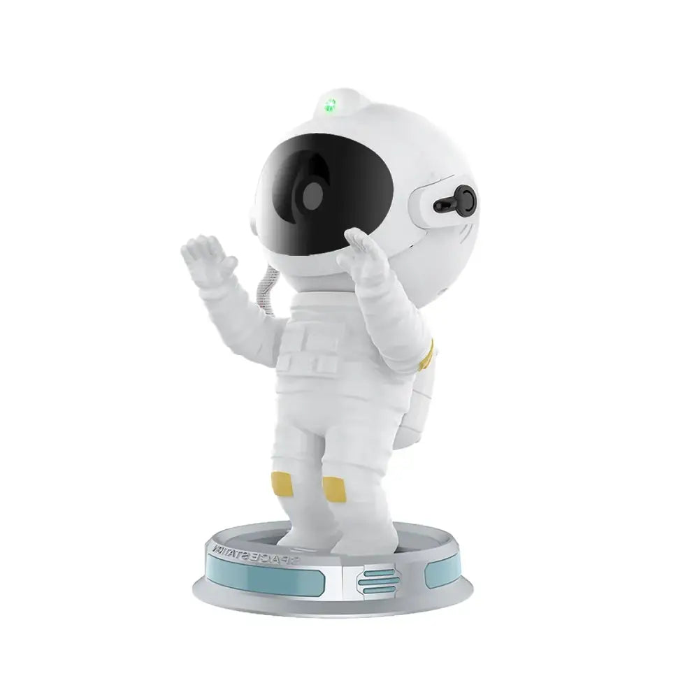 White astronaut figurine night light with black visor and yellow accents on circular base for decorbites galaxy star projector