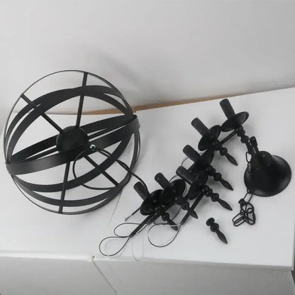 Black metal spherical iron pendant light with intersecting rings and eight candle-style bulbs for living room decorbites pendant light
