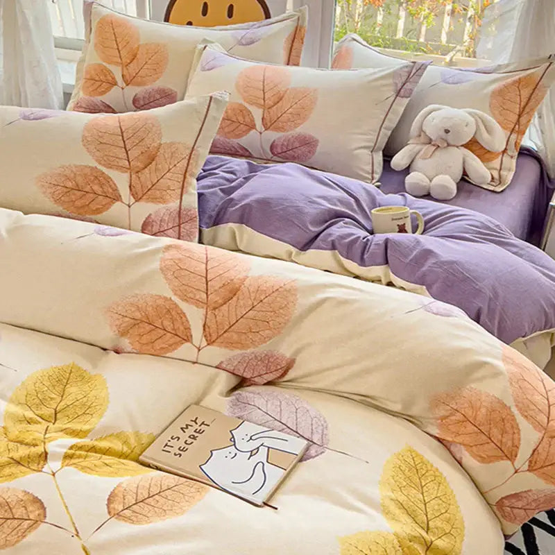 Cream-colored brushed cotton duvet cover set with soft autumnal leaf pattern in orange and purple for bedroom use