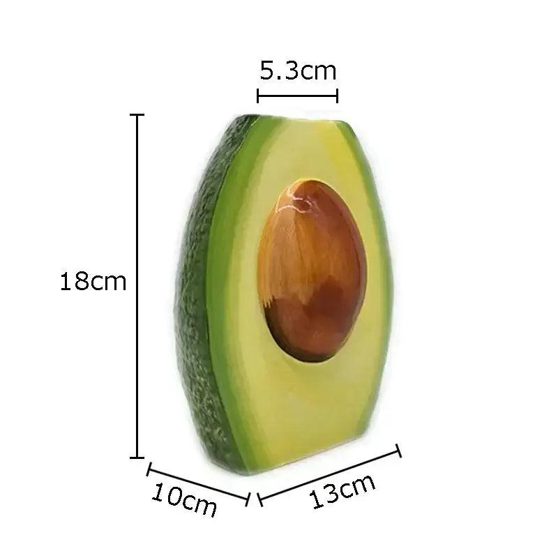 Glossy avocado ceramic vase with dark green outer skin and vibrant yellow-green flesh for living room decor