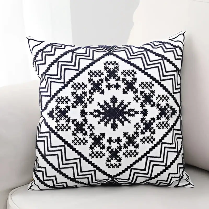 Black and white geometric patterned aztec embroidery canvas cushion cover with a diamond central design for living room use