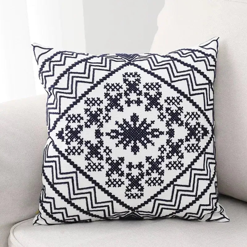 Black and white aztec embroidery canvas cushion cover with geometric zigzag borders and cross-stitch snowflake design