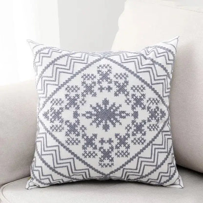 White throw pillow with aztec embroidery canvas featuring gray geometric snowflake and zigzag pattern cushion cover