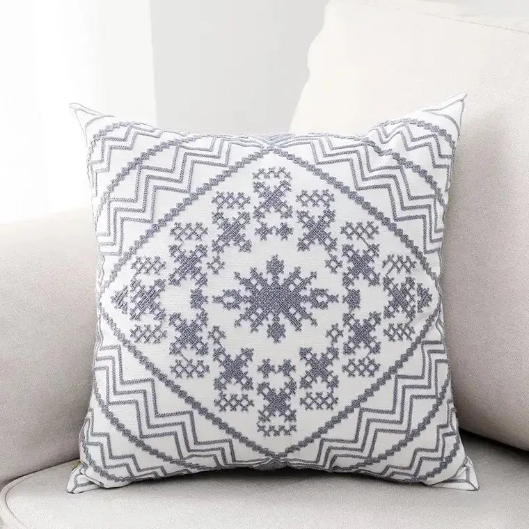 White throw pillow with aztec embroidery canvas featuring gray geometric snowflake and zigzag pattern cushion cover
