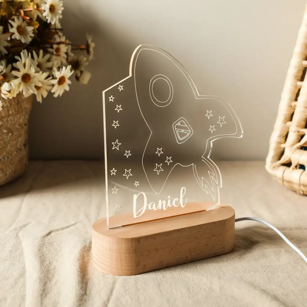 Decorbites™ clear acrylic rocket-shaped personalized children night light with engraved stars and name on wood base