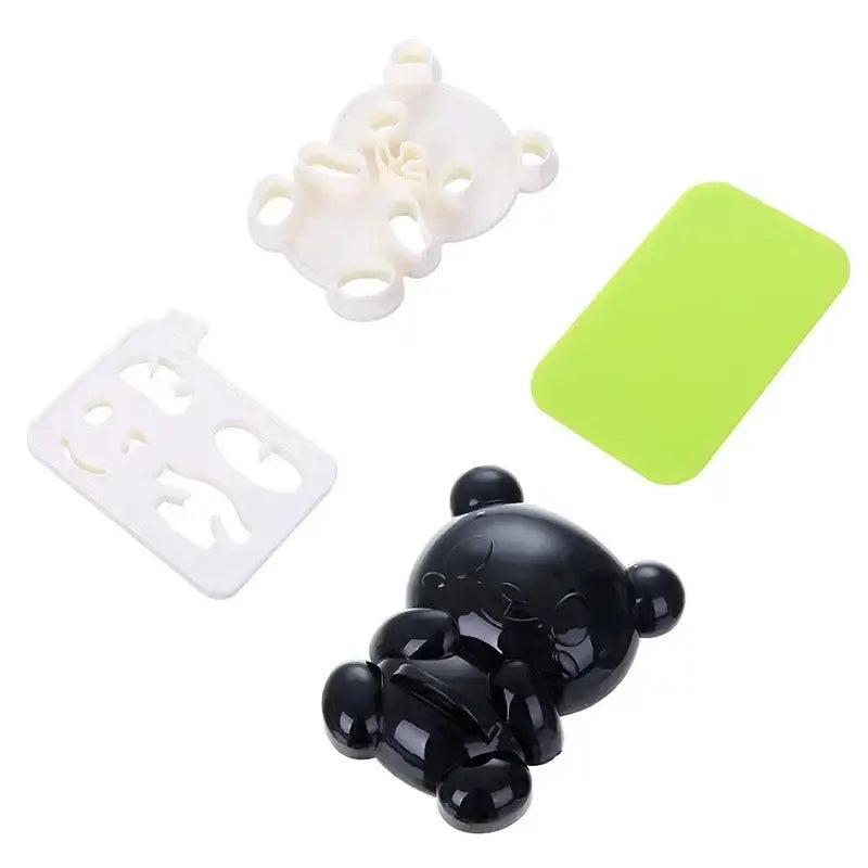 Black glossy baby panda sushi mold with rounded features and small ears for diy kitchen sushi and sandwich cutting