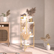 Minimalist four-tiered plant stand with gold-toned metal legs and white shelves holding dried plants for indoor use