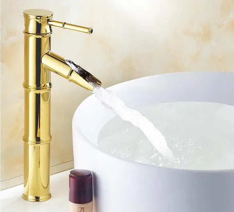 Golden bamboo antique brass and black basin mixer tap with sleek polished finish and waterfall spout for bathroom use