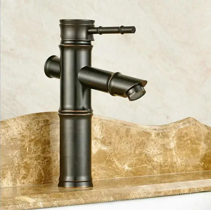 Black matte finished bamboo-style basin mixer tap with single handle and curved spout for bathroom use