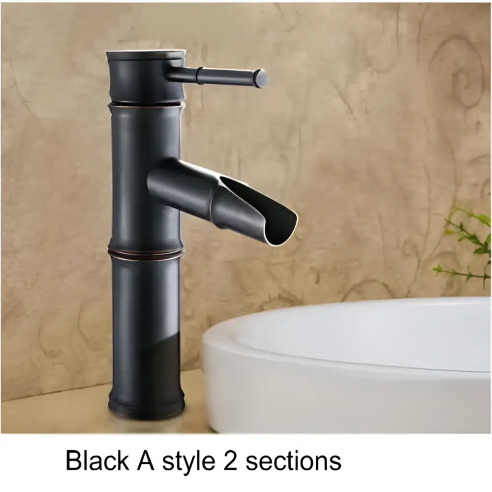 Black bamboo style basin mixer tap with matte finish and segmented design in antique brass and black for bathroom use