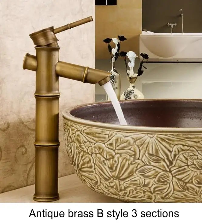 Antique brass bamboo-style basin mixer tap with three sections and polished warm metallic finish for bathroom basin