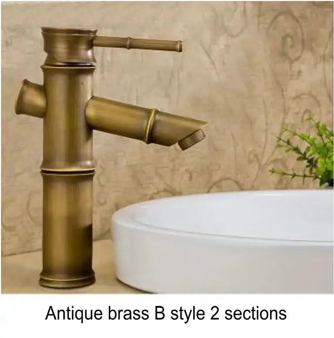 Antique brass bamboo-style basin mixer tap with segmented cylindrical design and single-handle spout for bathroom use