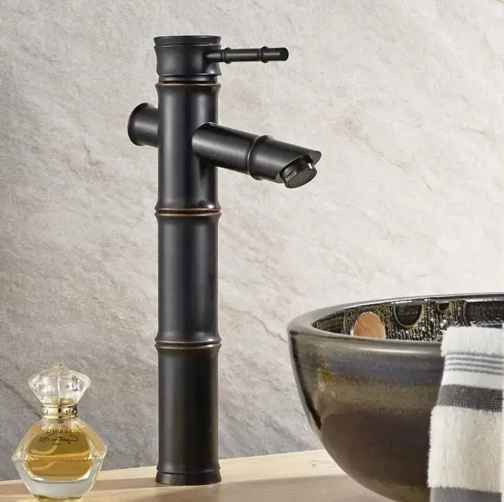 Black bamboo style basin mixer tap with matte finish and brass accents for bathroom basin mixer use